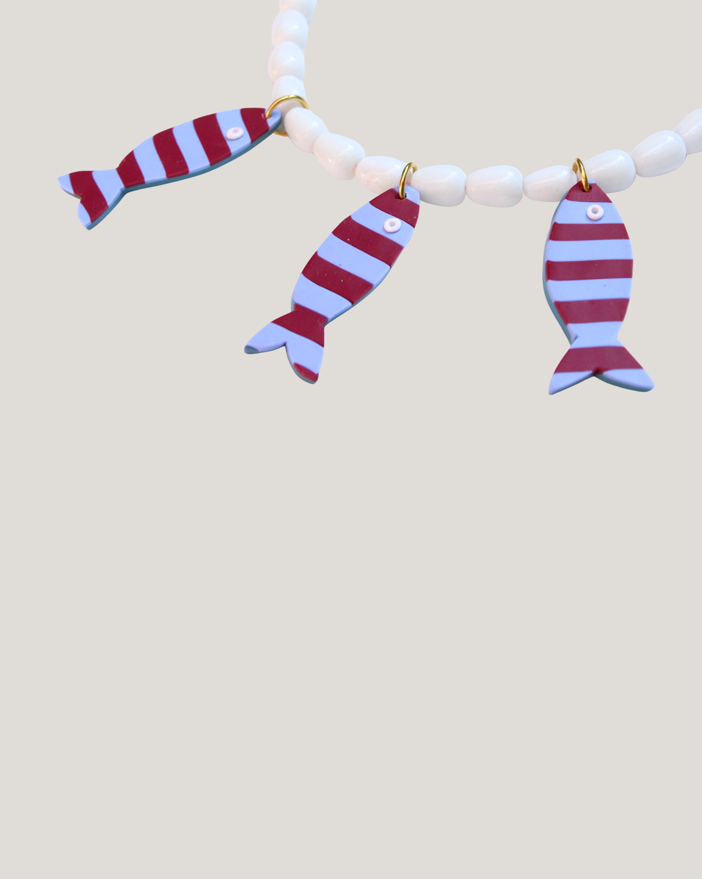 COLLAR PECES RAYAS BURDEO CELESTE