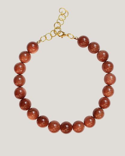 COLLAR PELOTAS CAFÉ BRILLO